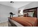 Bedroom with accent wall, wood-look floors and an exercise machine at 5402 E Mckellips Rd # 237, Mesa, AZ 85215