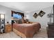 Bright bedroom showcasing neutral walls, wood floors, and a large window at 5402 E Mckellips Rd # 237, Mesa, AZ 85215