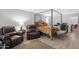 Bedroom featuring a canopy bed, comfortable seating area, and office space at 5402 E Mckellips Rd # 237, Mesa, AZ 85215
