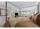 Comfortable bedroom featuring a four-poster bed, and a light gray paint palette at 5402 E Mckellips Rd # 237, Mesa, AZ 85215