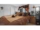 Comfortable bedroom with wood floors, neutral walls, and window with drapes at 5402 E Mckellips Rd # 237, Mesa, AZ 85215