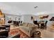 Open-concept living room and dining area with wood floors and rustic accents at 5402 E Mckellips Rd # 237, Mesa, AZ 85215