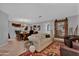 Open-concept living room and dining area with wood floors and rustic accents at 5402 E Mckellips Rd # 237, Mesa, AZ 85215