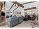 Spacious living room features exposed beams, fireplace, wet bar and comfortable seating at 5402 E Mckellips Rd # 237, Mesa, AZ 85215