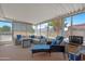 Relaxing screened porch featuring comfortable seating, perfect for outdoor enjoyment and relaxation at 5402 E Mckellips Rd # 237, Mesa, AZ 85215