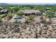 Aerial view of a desert home showcasing a private pool and outdoor living space at 5832 E Bent Tree Dr, Scottsdale, AZ 85266