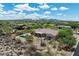 Stunning aerial view of a desert home featuring a private pool and beautiful mountain views at 5832 E Bent Tree Dr, Scottsdale, AZ 85266