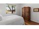 This bedroom features natural light and a rustic armoire, creating a cozy and inviting space at 5832 E Bent Tree Dr, Scottsdale, AZ 85266