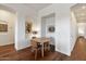 Cozy dining area with modern decor, art, and hardwood floors at 5832 E Bent Tree Dr, Scottsdale, AZ 85266