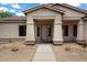 Inviting front entrance featuring a covered porch, showcasing the home's curb appeal at 5832 E Bent Tree Dr, Scottsdale, AZ 85266
