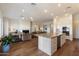 Expansive living space with hardwood floors, open layout connecting the living room, kitchen, and other living areas at 5832 E Bent Tree Dr, Scottsdale, AZ 85266