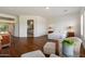 Bright main bedroom featuring a sitting area and hardwood floors at 5832 E Bent Tree Dr, Scottsdale, AZ 85266