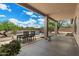 Enjoy outdoor dining under the covered patio, overlooking the pool and desert landscape at 5832 E Bent Tree Dr, Scottsdale, AZ 85266
