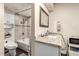 Bathroom featuring tiled shower and granite countertops, with updated fixtures and modern design at 618 E Manzanita Pl, Phoenix, AZ 85020