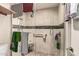 Shower with tiled walls and floors, glass door and grab bar at 618 E Manzanita Pl, Phoenix, AZ 85020