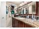 Bathroom featuring granite countertops, a sink, and a large mirror at 618 E Manzanita Pl, Phoenix, AZ 85020
