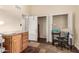 Spare bedroom with closet space, a desk, and built-in storage cabinets at 618 E Manzanita Pl, Phoenix, AZ 85020