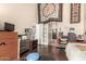 Bright bedroom with dark wood floors, dressers, and access to a closet at 618 E Manzanita Pl, Phoenix, AZ 85020