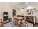 Cozy dining area featuring a wooden table, bar seating and a view into the kitchen at 618 E Manzanita Pl, Phoenix, AZ 85020
