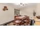 Traditional dining room with a wooden table, patterned rug and a window at 618 E Manzanita Pl, Phoenix, AZ 85020