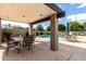 Community pool area with tables, chairs, and an outdoor seating area at 618 E Manzanita Pl, Phoenix, AZ 85020