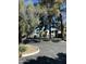 A street view featuring townhomes, mature trees, and well-maintained landscaping, enhancing curb appeal and community charm at 618 E Manzanita Pl, Phoenix, AZ 85020