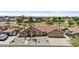 Lovely home on a lush golf course lot, featuring desert landscaping, a tiled roof, and a two-car garage at 6249 E Camelot Dr, Mesa, AZ 85215