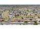 Wide aerial shot of a golf course community, highlighting lush landscaping and community ponds at 6249 E Camelot Dr, Mesa, AZ 85215
