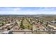 Expansive aerial view of golf course neighborhood with houses and green fairways at 6249 E Camelot Dr, Mesa, AZ 85215