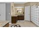 Elegant bathroom with custom vanity, mosaic tile backsplash, and glass block shower at 6249 E Camelot Dr, Mesa, AZ 85215
