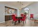 Inviting dining area with decorative mirror, chandelier, and a large window at 6249 E Camelot Dr, Mesa, AZ 85215