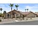 Inviting single-story home with desert landscaping, tile roof, and a convenient two-car garage at 6249 E Camelot Dr, Mesa, AZ 85215