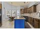 Bright kitchen boasts custom cabinetry, granite counters, and a center island at 6249 E Camelot Dr, Mesa, AZ 85215