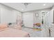 Bright bedroom features natural light, neutral color palette, and playful toy furniture at 6721 N 14Th Pl, Phoenix, AZ 85014