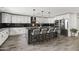 Bright kitchen featuring white cabinets, subway tile backsplash, large island with seating, and stainless steel appliances at 6721 N 14Th Pl, Phoenix, AZ 85014
