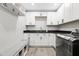 Updated laundry room with white cabinets, bench seating, and modern appliances at 6721 N 14Th Pl, Phoenix, AZ 85014