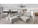 Spacious open-concept living room with a large sectional couch and seamless access to the modern kitchen at 6721 N 14Th Pl, Phoenix, AZ 85014