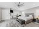 The large main bedroom features wood-look tile floors and a designated area for a workspace and media at 6721 N 14Th Pl, Phoenix, AZ 85014