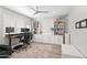 Bright office space with built-in shelving, a large desk, and a neutral rug at 6721 N 14Th Pl, Phoenix, AZ 85014