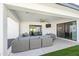 Stylish outdoor living area with comfortable seating, ceiling fan, and seamless indoor-outdoor flow for sophisticated relaxation at 6721 N 14Th Pl, Phoenix, AZ 85014