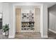 Walk-in pantry with custom shelving, a countertop, and sliding wooden doors for an organized storage space at 6721 N 14Th Pl, Phoenix, AZ 85014