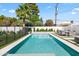Beautiful backyard pool with a sleek design, surrounded by lush greenery and comfortable lounge area, perfect for relaxation at 6721 N 14Th Pl, Phoenix, AZ 85014