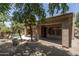 View of backyard showing patio, desert landscaping, and a freeform pool at 6917 E Night Glow Cir, Scottsdale, AZ 85266