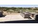 Backyard patio area featuring comfortable seating, a fire pit, and picturesque golf course views at 6917 E Night Glow Cir, Scottsdale, AZ 85266