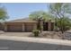 Charming single-story home featuring a three-car garage and desert landscaping, located in a desirable neighborhood at 6917 E Night Glow Cir, Scottsdale, AZ 85266
