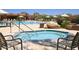Relaxing community hot tub with lounge chairs and desert landscaping at 6917 E Night Glow Cir, Scottsdale, AZ 85266