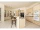 Bright eat-in kitchen featuring light-colored cabinets, tile floors, and modern appliances at 6917 E Night Glow Cir, Scottsdale, AZ 85266