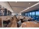 Bright restaurant featuring wood floors, comfortable seating, modern lighting, and large windows with views at 6917 E Night Glow Cir, Scottsdale, AZ 85266