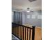 Upstairs bedroom featuring wood floors, gray walls, and a ceiling fan at 7224 W Pioneer St, Phoenix, AZ 85043