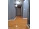 Long upstairs hallway featuring wood floors and gray walls at 7224 W Pioneer St, Phoenix, AZ 85043
